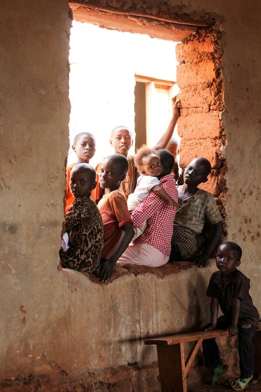 Children gathered by a classroom doorway